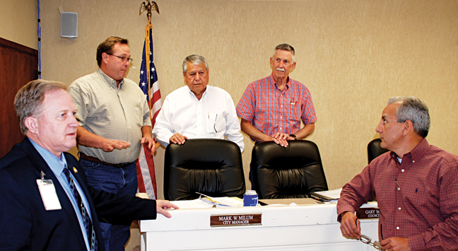 (l-r)Los Fresnos City Manager Mark W. Milum, Commissioner Alan Atherton, Mayor Polo Narvaez, Commissioners Gary Minton and Javier Mendez gather before heading in for executive session at their regular meeting last Tuesday night. Commissioner Swain Real was out of the room at the time of the photo and Mayor Pro-Tem Yolanda H. Cruz was not in attendance at the meeting.           LFN Photo