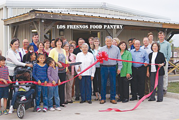 Community and volunteers at the ribbon cutting for the new Food Pantry.