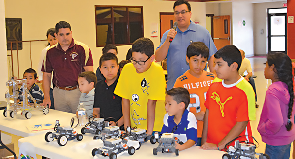 Students in the LFCISD GT Summer Robotics Program look over their projects. Photo: LFCISD.