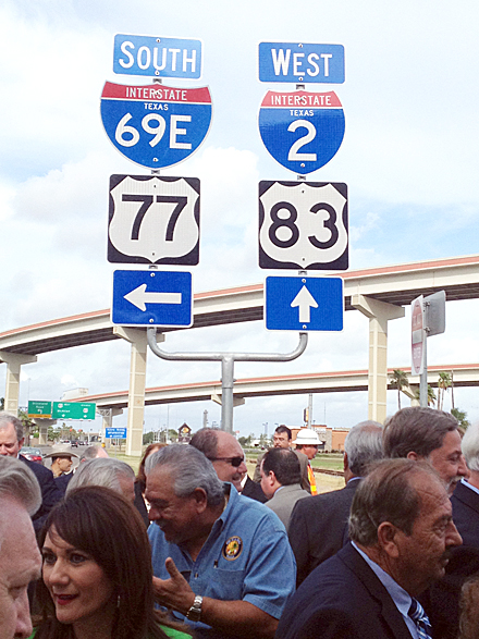Several local, state and federal officials, as well as local residents, gather for a photo in front of the new I-69 signage that was unveiled by TXDOT during a ceremony on Monday, July 15, 2013, at the U.S. 83 and 281 interchange in Harlingen.  Photo: Lori Weaver