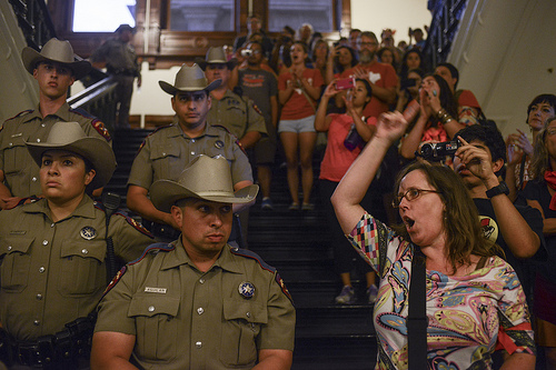 Texas Rangers lined the stairwells and halls of the Capitol rotunda during this month's peaceful protests against HB2. Photo by Lauren Gerson.