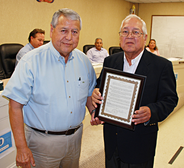 Los Fresnos Mayor Polo Narvaez presents a proclamation to the founder of International Education Services, Ruben Gallegos Ph.D ,(right) to honor the organization’s 25 years of service to the community. LFN Photo: MBWright
