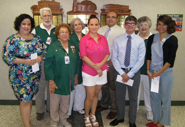 Above, from left to right in the front row, is scholarship recipient Christina Aguilar; Valley Baptist-Brownsville Auxiliary Volunteer Scholarship Committee Member Lupita Soto; and scholarship recipients Christina Villarreal, Emede Tovar Jr. and Alejandra Machuca.  In the back row are VBMC-Brownsville Auxiliary Scholarship Committee Members Jerry and Blanca Osborn; scholarship recipient Jose G. Sosa; and VBMC-Brownsville Auxiliary Scholarship Chairperson Virginia Restovich.  