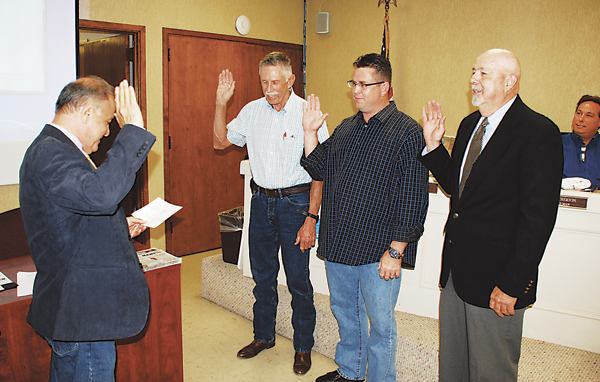 Cameron County Judge Carlos Cascos swears in City of Los Fresnos councilmen  (l-r) Gary Minton, Swain Real and Tom Jones. Incumbent Minton and Real continue for another three years on the council and newly-elected Jones will complete the unexpired term of Alan Atherton.