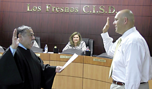 Ruben Treviño (right) is sworn into office by Justice of the Peace Bennie Ochoa