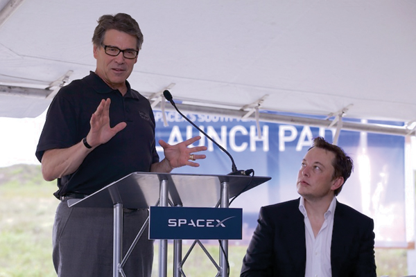 Governor Rick Perry addresses media and community members during the groundbreaking ceremony for the new SpaceX facility in Cameron County as SpaceX founder Elon Musk looks on. Photo: Office of the Governor, http:// http://governor.state.tx.us/
