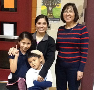 Blanca Ortiz and her children with Mary Alcala of the Boys & Girls Club of Los Fresnos
