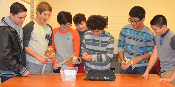 LFU Engineering students demonstrate the claw they designed to pick up marbles. Photo: LFCISD