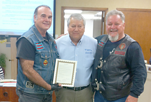 From L to R:  Gary Snyder - Elder BFC Ministry, Mayor Polo Narvaez and John Peacock - BFC Road Captain display the May is Motorcycle Safety and Awareness Month proclamation.