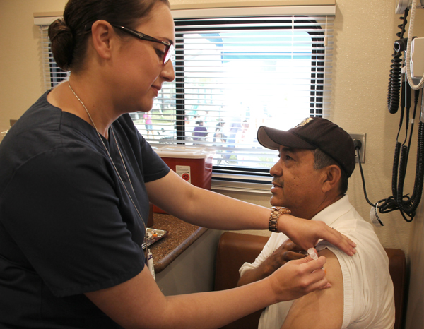   Juan Moreno, pastor of La Iglesia de los Hechos in the Indian Hills neighborhood, receives a vaccine from the Hidalgo County Health and Human Services Department. The UTRGV School of Medicine and Hidalgo County Health and Human Services Department kicked off the colonia health care program as part of the South Texas Interprofessional Collaborative for Health Care, or STITCH. (UTRGV Photo)