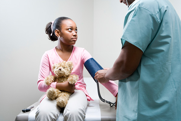 One year after the rollout of the Affordable Care Act, the uninsured rate for children is at a historic low, according to a new report. Photo: XiXinXing/iStockphoto.