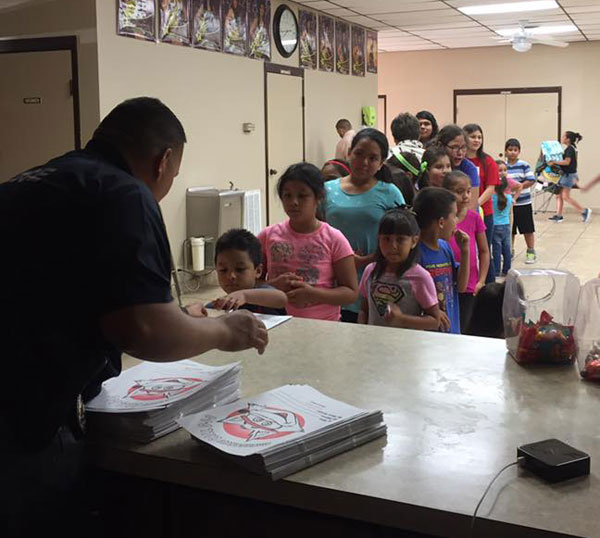 Los Fresnos PD hand out candy and coloring books at the Thursday, July 7th movie night.